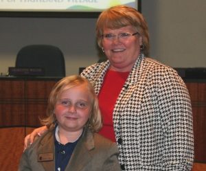 McAuliffe Elementary student Fox Lisby assists Mayor Charlotte Wilcox as Mayor for the Day.