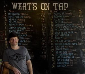 Brad Trapnell creates a hangout for beer connoisseurs at What's On Tap in Highland Village. (Photo by Bill Castleman)