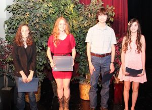 The Jerry Simpson Memorial Short Story Contest winners included (left to right) Grace Teague (honorable mention), Paige Woelke (honorable mention), Samuel Blalock (third place) and Lindsay Tito of Liberty Christian School (second place).