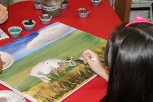 A student works to perfect her own techniques during art classes at Studio Art House. 
