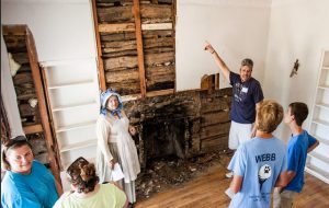 An estimated 2,300 people viewed history close up in Flower Mound on Aug. 15, 2015 at the site of a 1860s-era log cabin open to the public for the first time. (Photo by Zero Drift Media/Bob VanOrden)