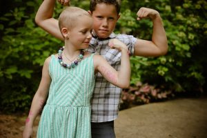 Sadie Keller of Lantana, pictured with her big brother, Grant, is being strong for herself and other children who are facing cancer. (Photo by Ashley Ford Photography)