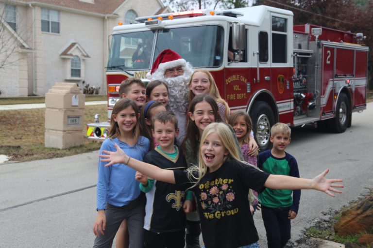 Santa Claus visits Double Oak families